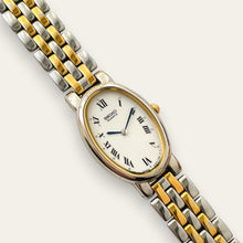 Load image into Gallery viewer, Vintage Seiko Two-Tone Oval Quartz Watch Blued Hands Roman Numerals
