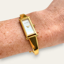 Load image into Gallery viewer, Vintage Gucci 1500L Gold Bangle Watch with Mother of Pearl Dial, 90s Quartz
