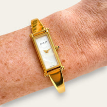Load image into Gallery viewer, Vintage Gucci 1500L Gold Bangle Watch with Mother of Pearl Dial, 90s Quartz
