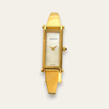 Load image into Gallery viewer, Vintage Gucci 1500L Gold Bangle Watch with Mother of Pearl Dial, 90s Quartz
