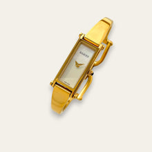 Load image into Gallery viewer, Vintage Gucci 1500L Gold Bangle Watch with Mother of Pearl Dial, 90s Quartz
