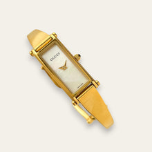 Load image into Gallery viewer, Vintage Gucci 1500L Gold Bangle Watch with Mother of Pearl Dial, 90s Quartz
