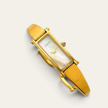 Load image into Gallery viewer, Vintage Gucci 1500 Gold Bangle Watch with Mother of Pearl Dial, 90s Quartz
