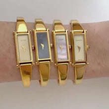 Load and play video in Gallery viewer, Vintage Gucci 1500L Gold Bangle Watch with Mother of Pearl Dial, 90s Quartz
