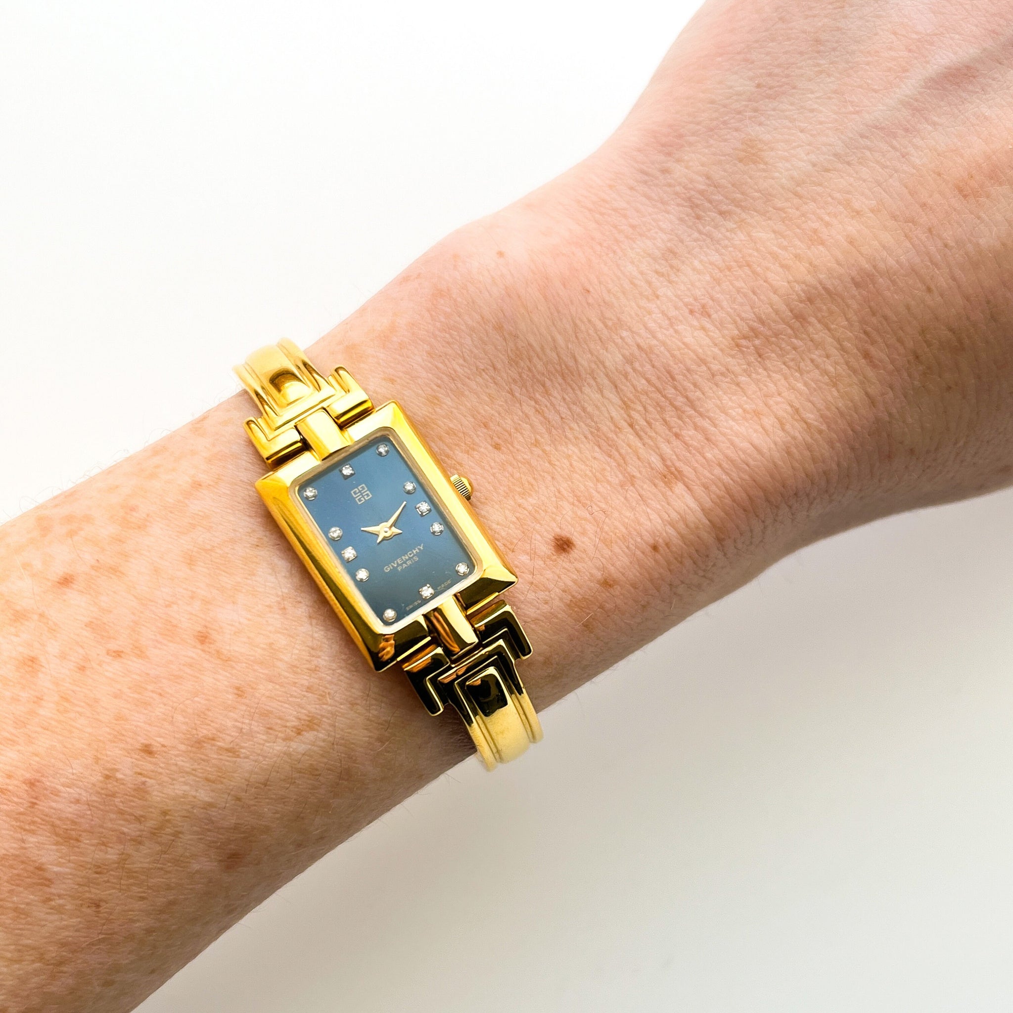 Vintage 1995 Gold Plated Ladies Givenchy Bangle Watch with Blue Dial and Quartz Movement